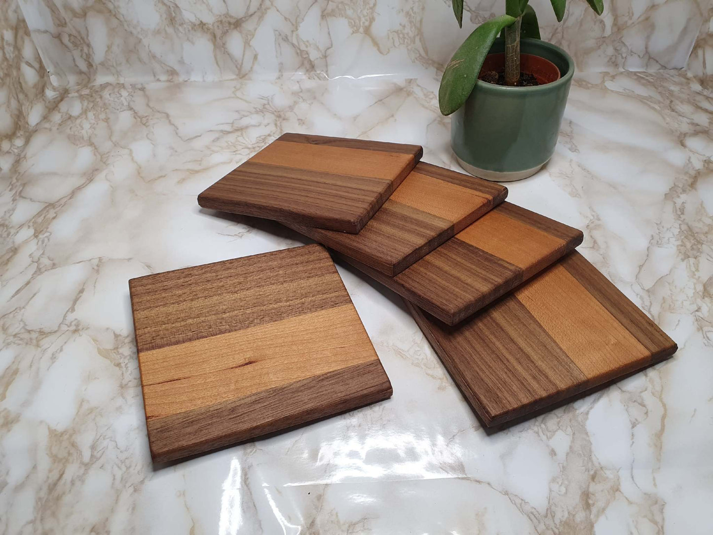 Set of 4 handmade coasters with holder in walnut and cherry wood.