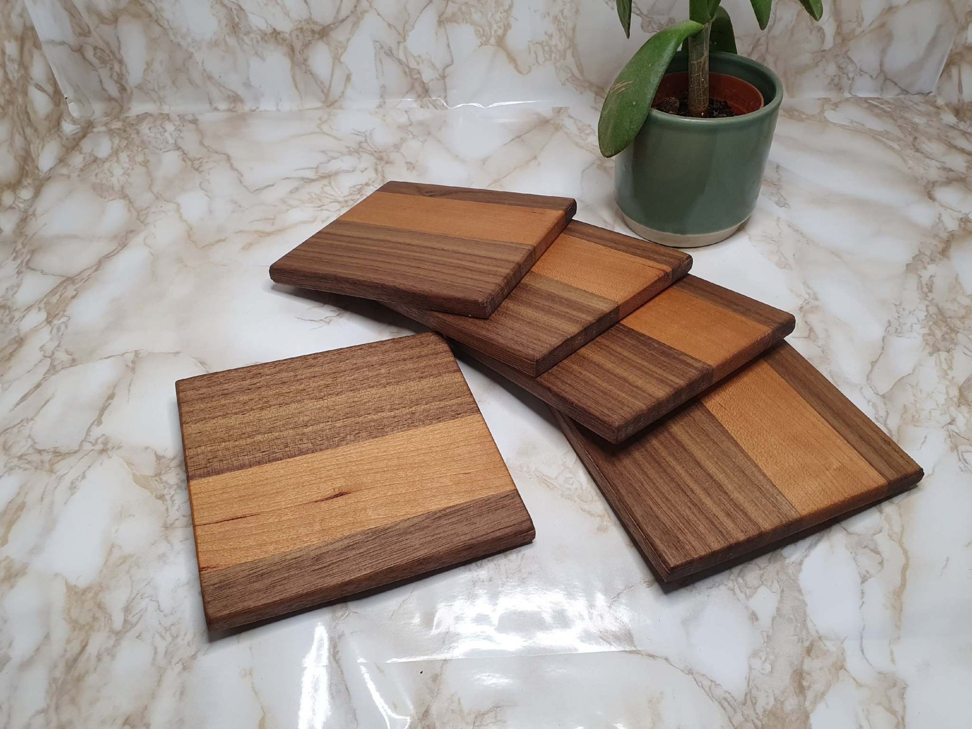 Set of 4 handmade coasters with holder in walnut and cherry wood.