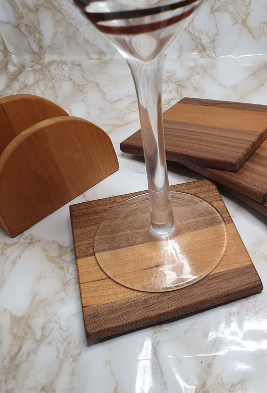 Set of 4 walnut and cherry coasters with holder, featuring elegant wood design.