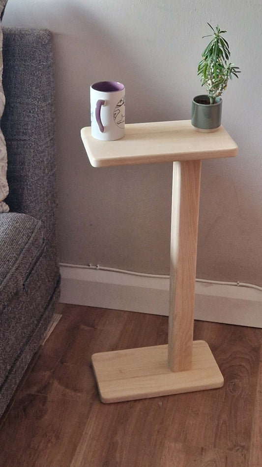 Handmade oak wooden couch table with a sleek C-shape design, perfect for modern and minimalist spaces.