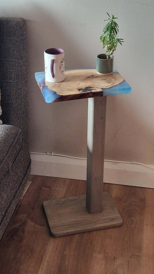 Handmade Oak Wooden couch table with epoxy finish, 30cm x 20cm, next to a chair; features a mug and a small plant.